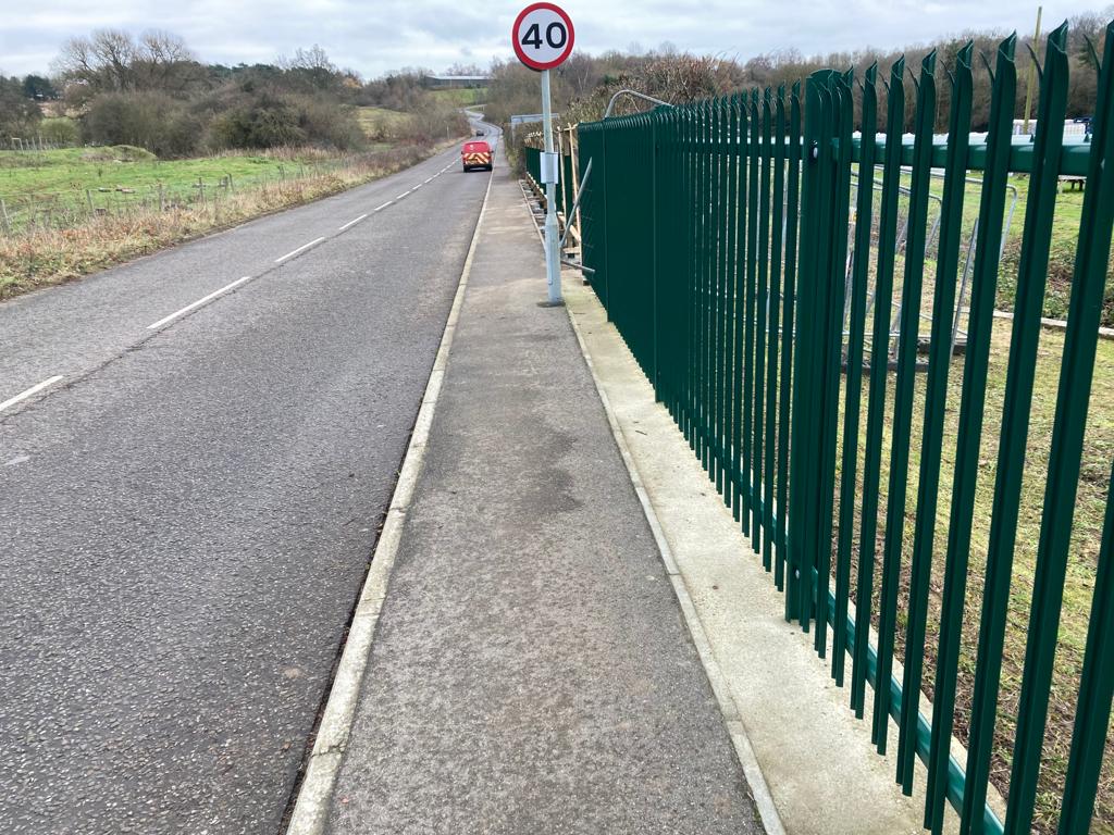 Palisade fencing installed on a roadside