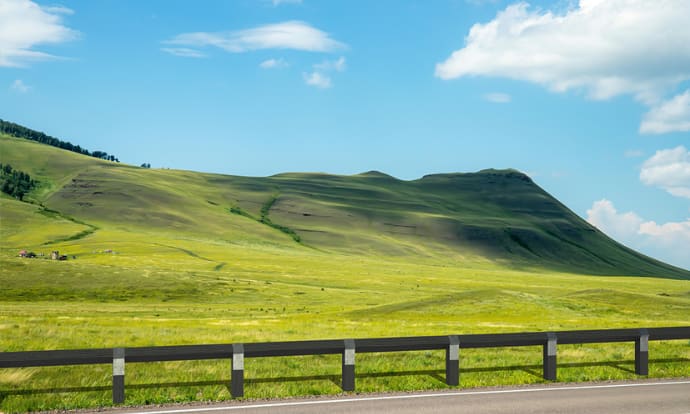 Recycled plastic knee rail installed alongside road