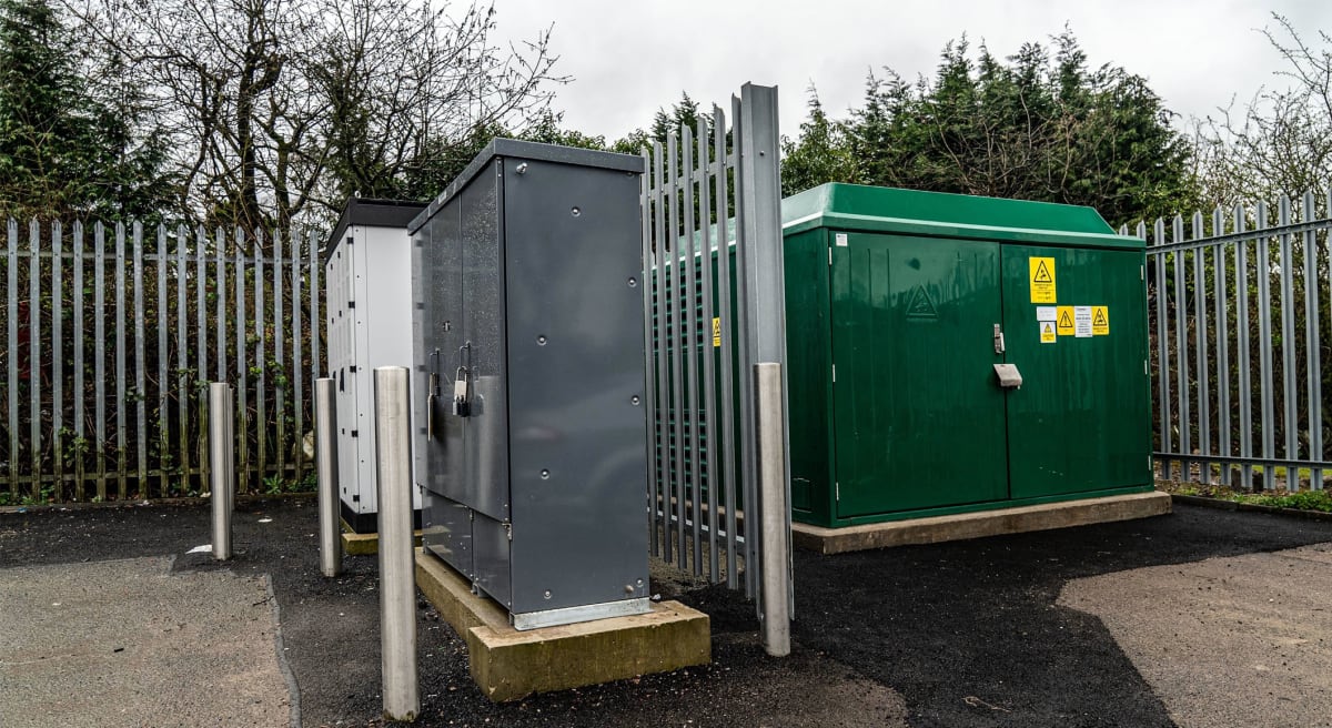 A perimeter of Non-Conductive Palisade Fencing around a Generator