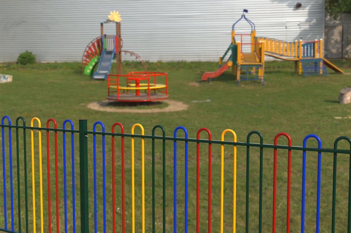 Rainbow Bow Top Railings around a play area