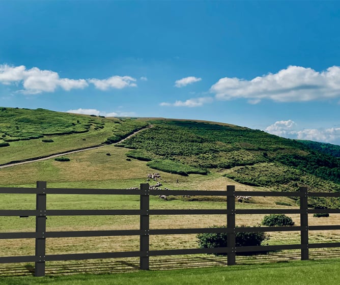 Recycled Plastic Post and Rail Fencing installed around mountain side 