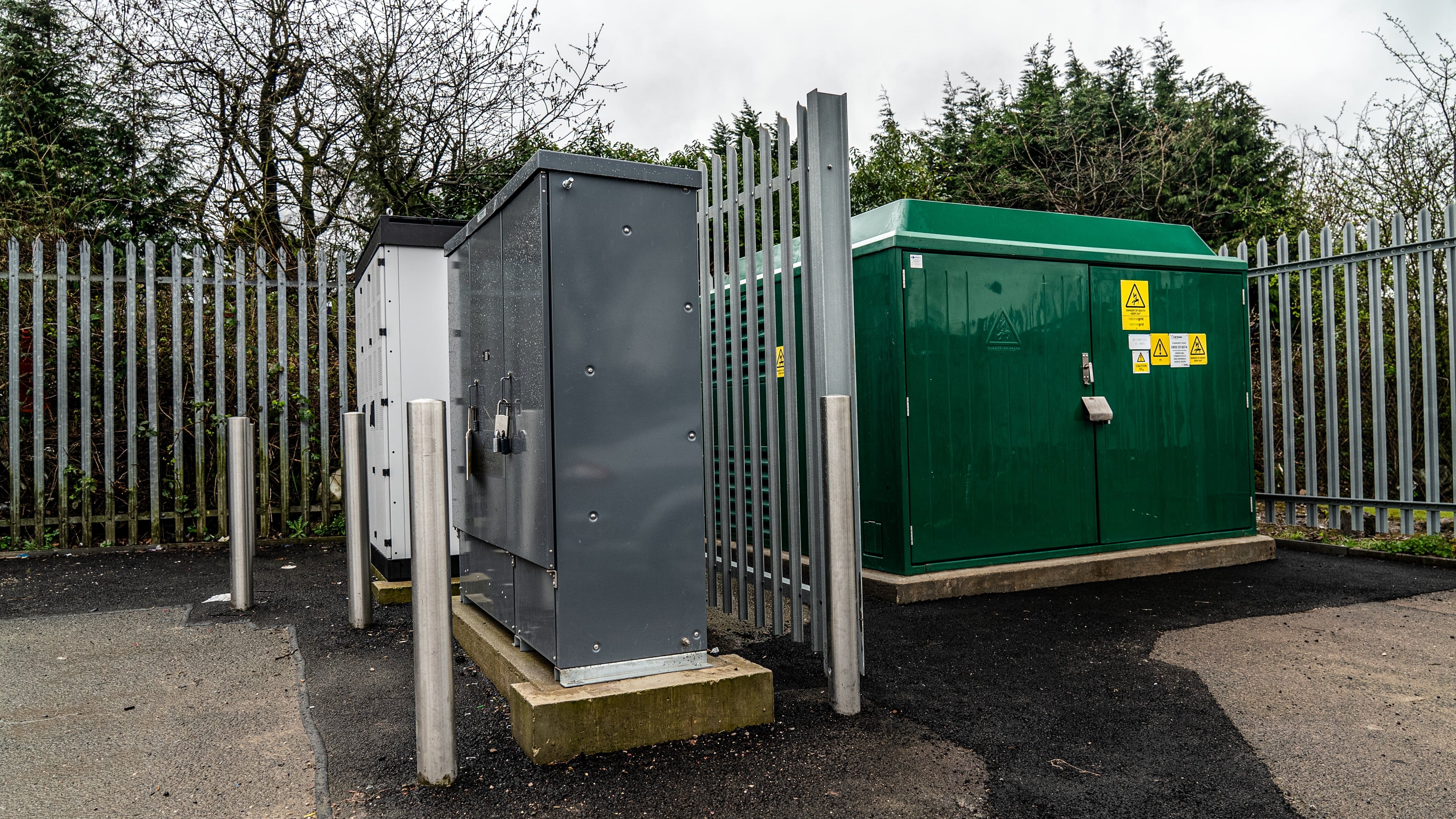 Palisade fencing around an outdoor generator