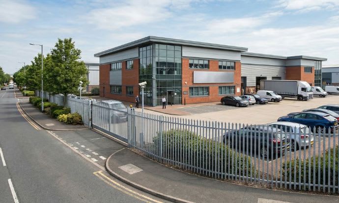Standard palisade fencing and gates installed outside a commercial property