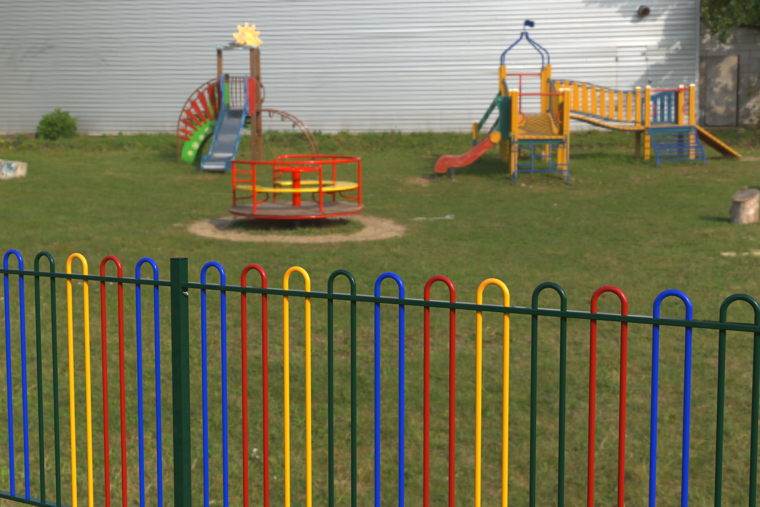 Playground with colourful fencing