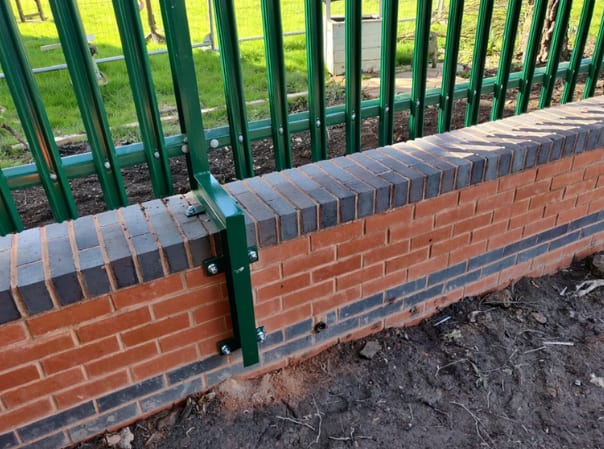 Posts bolted to a brick wall