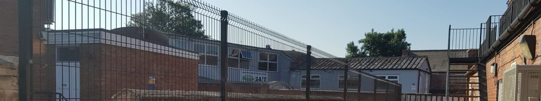 V mesh fencing mounted onto brick wall