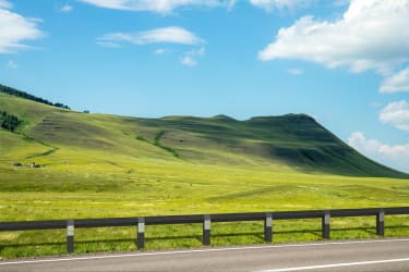 Knee rail alongside mountains