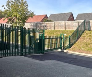 Palisade cantilever gate and fencing installed round business car park