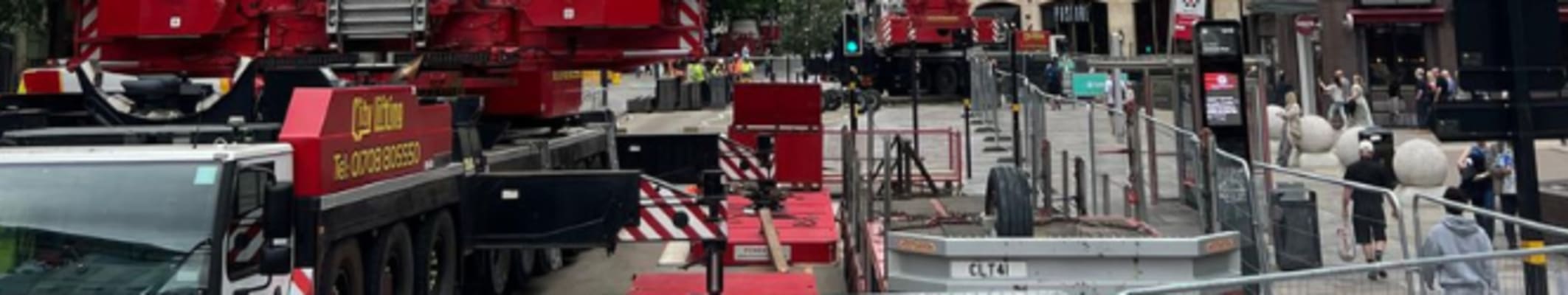 Temporary fencing protecting a building site and crane