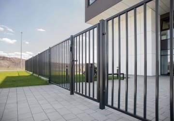 A Black Swing Gate outside of an office 