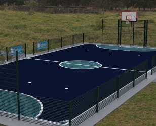 MUGA fencing installed in a grassy field