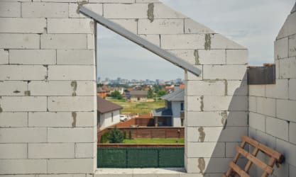 A steel lintel installed above a window gap
