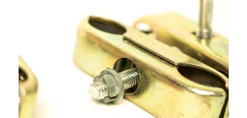 Close up of anti-tamper bolt for anti-tamper coupler