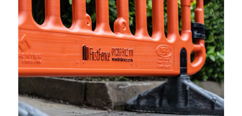 Close up of First Fence branded logo on Barrier