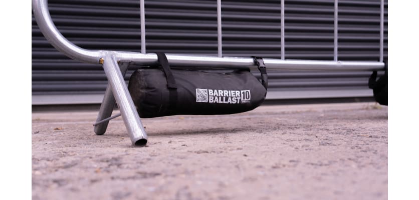 Standard crowd control barrier with ballast bag attached