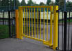 Gate Closer on a Yellow Gate