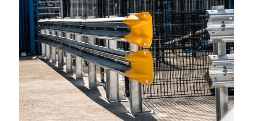 Double beam armco with yellow fish tail ends and bolt down posts