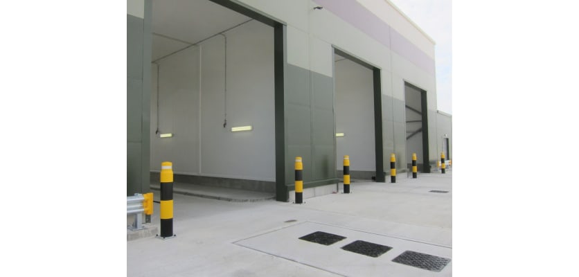 Yellow and Black bollards protecting entrance loading bays