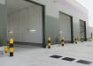 Yellow and Black bollards protecting entrance and bay in a warehouse