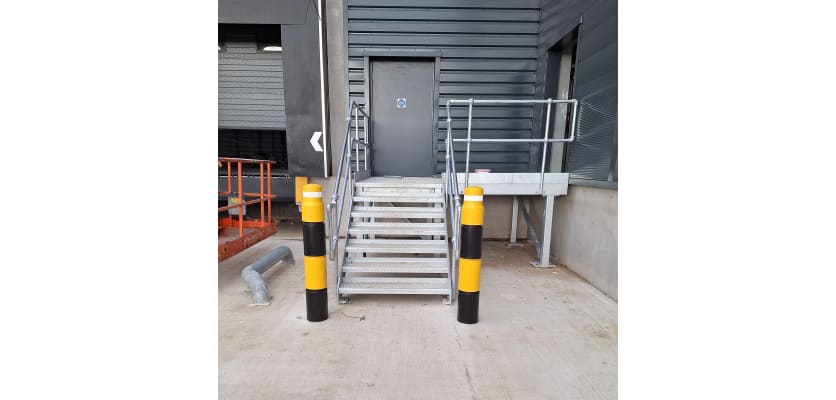 Black and Yellow Potted Bollards installed near stairs