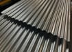 Close up of two corrugated metal sheets overlapping each other 