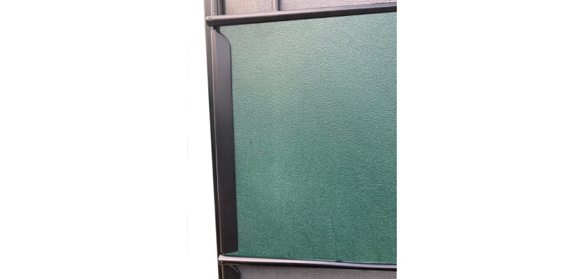 Clips installed on mesh panel with green privacy strips 