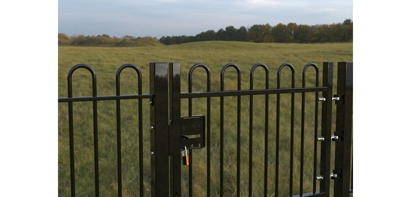 EnviroRail® Black Bow Top Single Leaf Gate Kit installed in field 