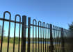 Top section of a Black EnviroRail® Bow Top double leaf gate installed at a park