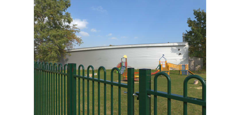 EnviroRail® Bow Top Railing Gate in Green installed at a play area