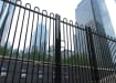 EnviroRail® Bow Top Railing Gate in Black installed outside a city office 