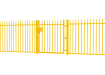 A Yellow EnviroRail® Vertical Bar Railing Gate installed in row of railings