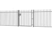 A Grey EnviroRail® Vertical Bar Railing Gate installed in row of railings