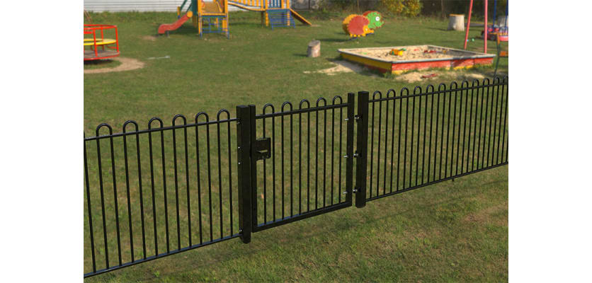 A Black Single Leaf EnviroRail® PlaySec Railing Gate securing play area