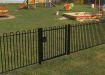 A Black Single Leaf EnviroRail® PlaySec Railing Gate securing play area