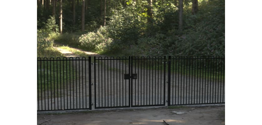A Black Double Leaf EnviroRail® PlaySec Railing Gate securing a private road 