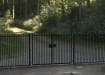A Black Double Leaf EnviroRail® PlaySec Railing Gate securing a private road 