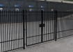A Black Double Leaf EnviroRail® PlaySec Railing Gate securing a school