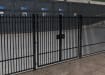 A Black Double Leaf EnviroRail® PlaySec Railing Gate securing a school