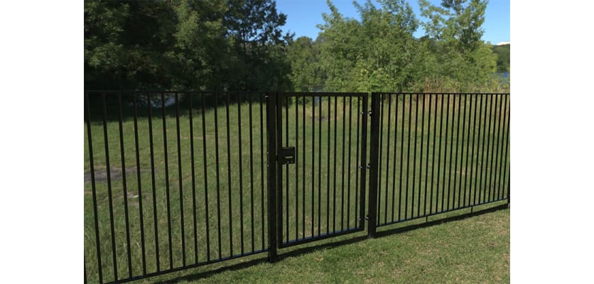Black EnviroRail® Flat Top Single Leaf Gate Kit installed in park.