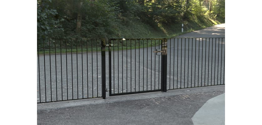 A Black Single Leaf Standard Flat Top Railing Gate securing a Car Park 