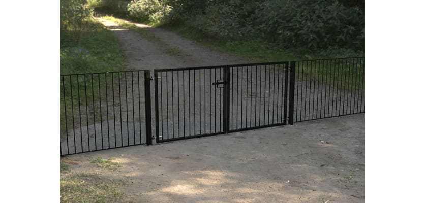 A Black Double Leaf Standard Flat Top Railing Gate securing a Private Road 