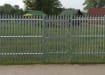 PaliFence® Palisade Security Single Leaf Gate in a perimeter around an outdoor picnic area