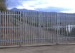 PaliFence® Palisade Security Double Leaf Gate Securing a Private Road near a Beach