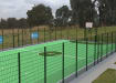 MUGAPlay® Secure 38 Rebound MUGA Kit, showing the football goal and basketball hoop, installed on a field
