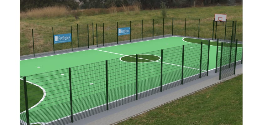 MUGAPlay® Secure 38 Rebound MUGA Kit positioned on a grass field