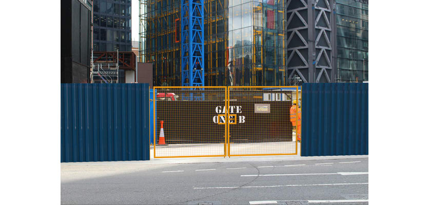 Yellow Site gate installed around building site 