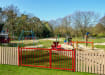 PlaySecure® 1.0m x 2.9m Wide Machine Access Double Railing Gate Kit installed alongside timber fencing