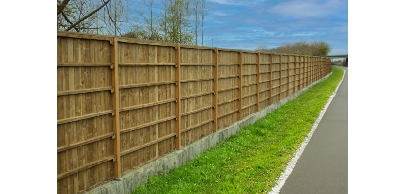 EchoReflect Reflective Acoustic Fencing Kit installed on noisy roadside