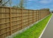 EchoReflect Reflective Acoustic Fencing Kit installed on noisy roadside