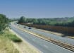 EchoReflect Reflective Acoustic Fencing Kit installed next to busy highway